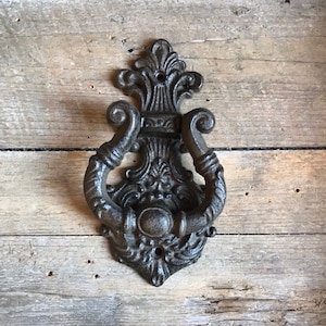 Vintage styled door knocker made of cast iron