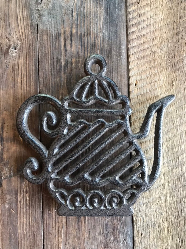 Fancy tea kettle trivet made of cast iron Etsy