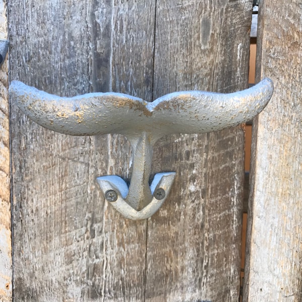 Whale tail wall hook in the New Mercury finish. A great option to use in a bathroom or bedroom. Perfect for towels, scarfs, or jewelry.