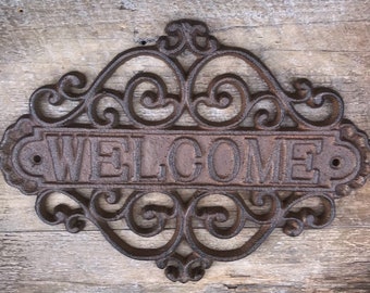 Metal welcome home sign for entryways, doorways and doors. This cast iron sign is built to last, made just like the vintage signs of old.