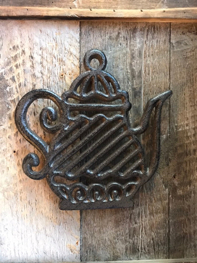 Fancy tea kettle trivet made of cast iron Etsy
