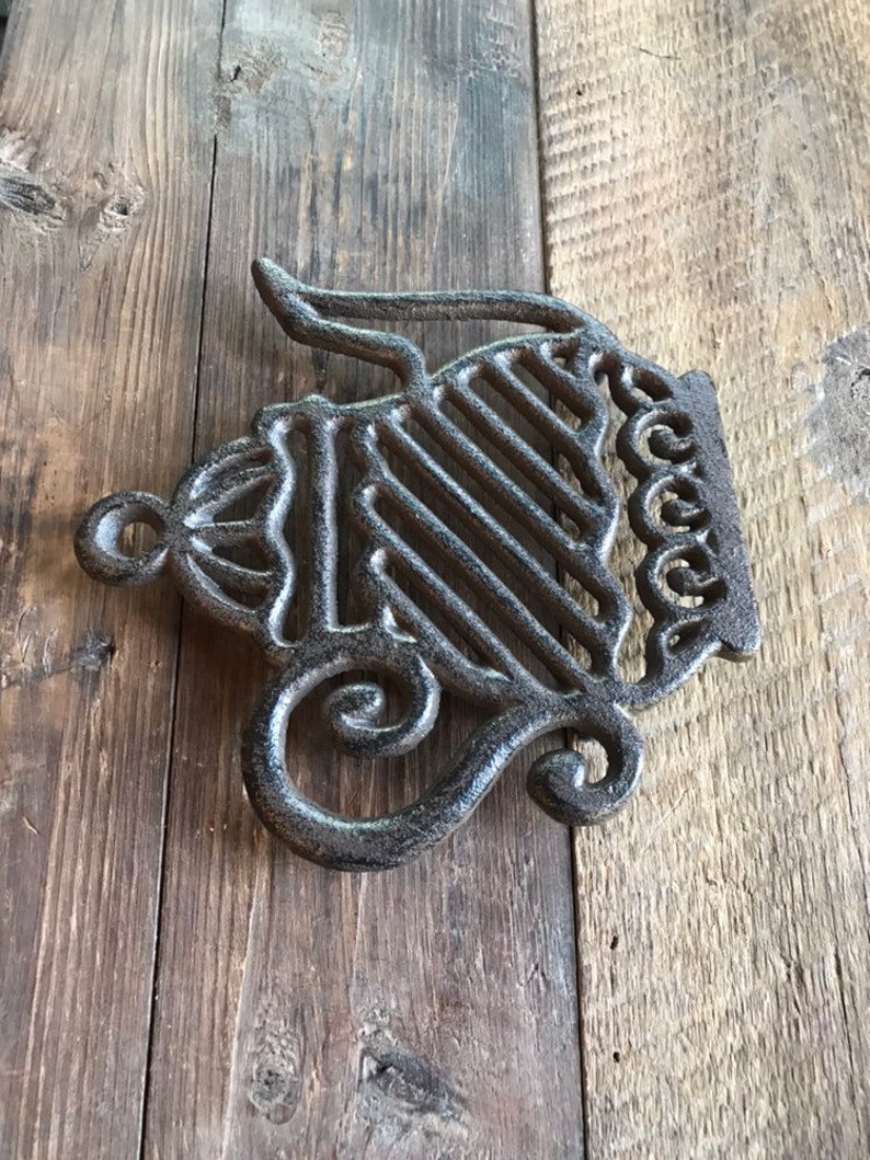 Fancy tea kettle trivet made of cast iron Etsy