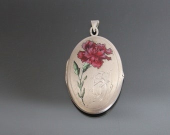 Medaglione con fiore di Dianthus smaltato in stile Art Nouveau. Ciondolo antico in alpacca. Monogramma HH
