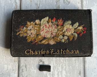 May include: A black needlepoint box with a floral design and the text "Charles & Johanna" on the front.