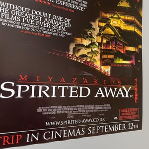 May include: A movie poster for Miyazaki's "Spirited Away" features a dark background with the film's title in large white letters. The poster includes a quote and an illustration of a bridge and buildings.