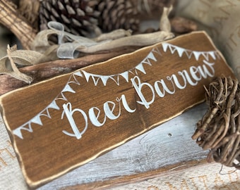 Beer Barrow sign decorated with bunting and ribbon