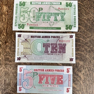 May include: Three British Armed Forces special vouchers, one for 50 pence, one for 10 pence, and one for 5 pence. Each voucher is green and white with red and black text. The vouchers are from the 6th series and are issued by command of the Defence Council.