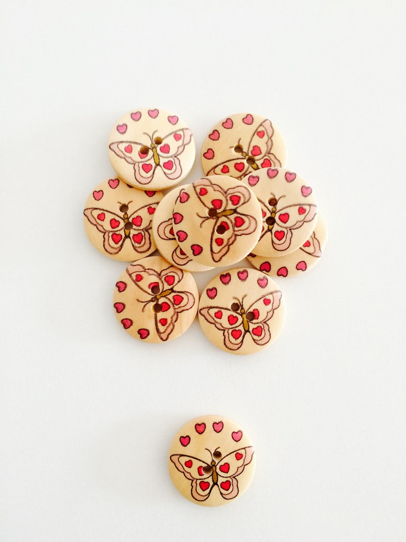 Buttons with butterfly motif in wood image 1