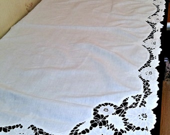 a tablecloth embroidered cutwork