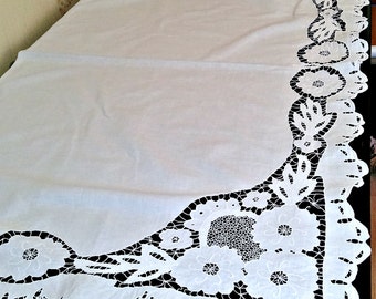 a tablecloth embroidered cutwork