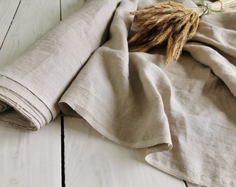 Natürlicher Leinenstoff, weicher gewaschener Flachs, Leinentuch, mittelschwerer beiger Leinenstoff, Leinenstoff als Massenware, Flachsleinenstoff.