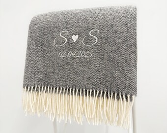 May include: A grey and white herringbone patterned throw blanket featuring white embroidered text that reads S heart S and the date 02.09.2025. The blanket has a textured weave and is finished with long, cream-colored fringe along the bottom edge.