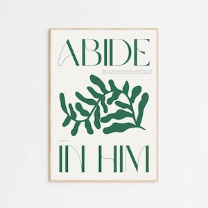 Puede incluir: Una rama verde con hojas con la palabra "ABIDE" en blanco arriba y las palabras "IN HIM" en verde abajo. El texto "John 15:4" está en blanco más pequeño debajo de la rama. El fondo es blanco.