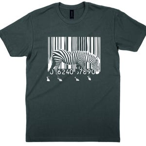 May include: Dark teal t-shirt with a white graphic of a zebra incorporated into a barcode. The zebra's stripes are prominent, and the barcode includes the numbers 062407890. A casual tee for all.