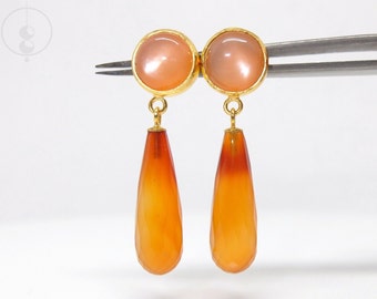 Golden earrings with orange gemstones, gold-plated earrings with moonstones and faceted carnelian pears as pendants