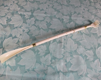 A lovely vintage plasticated and brass shoe horn and back scrather, Made in France