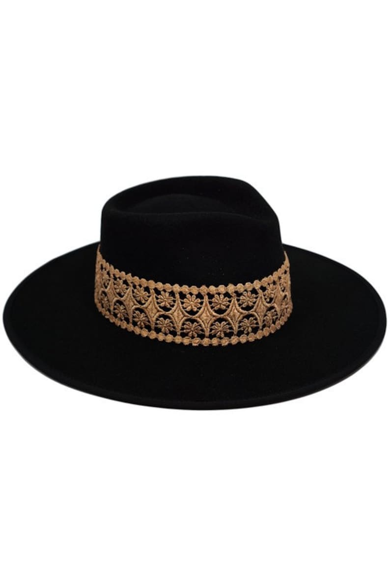 May include: A black felt fedora hat with a gold embroidered band. The band features a repeating pattern of small flowers and geometric shapes.