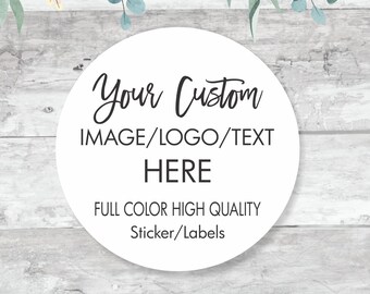 May include: A white circle sticker with a woodgrain background. The sticker has text that reads "Your Custom IMAGE/LOGO/TEXT HERE FULL COLOR HIGH QUALITY Sticker/Labels". The sticker is surrounded by watercolor greenery and flowers.