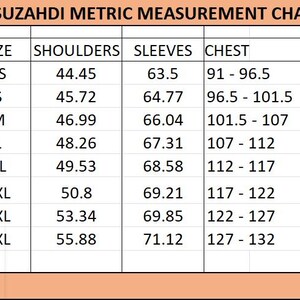 May include: A Suzahdi metric measurement chart with a peach-colored header. The table lists sizes from XS to 4XL with corresponding measurements in centimeters for shoulders, sleeves, and chest. The chest column displays ranges for each size.