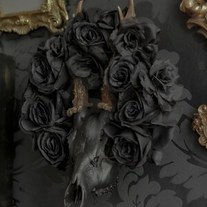 Black matte deer skull with natural antlers and black flower crown for dark or gothic gift for home decor