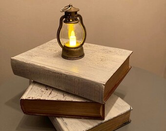 table decoration vintage books with terrestrial globe or lamp