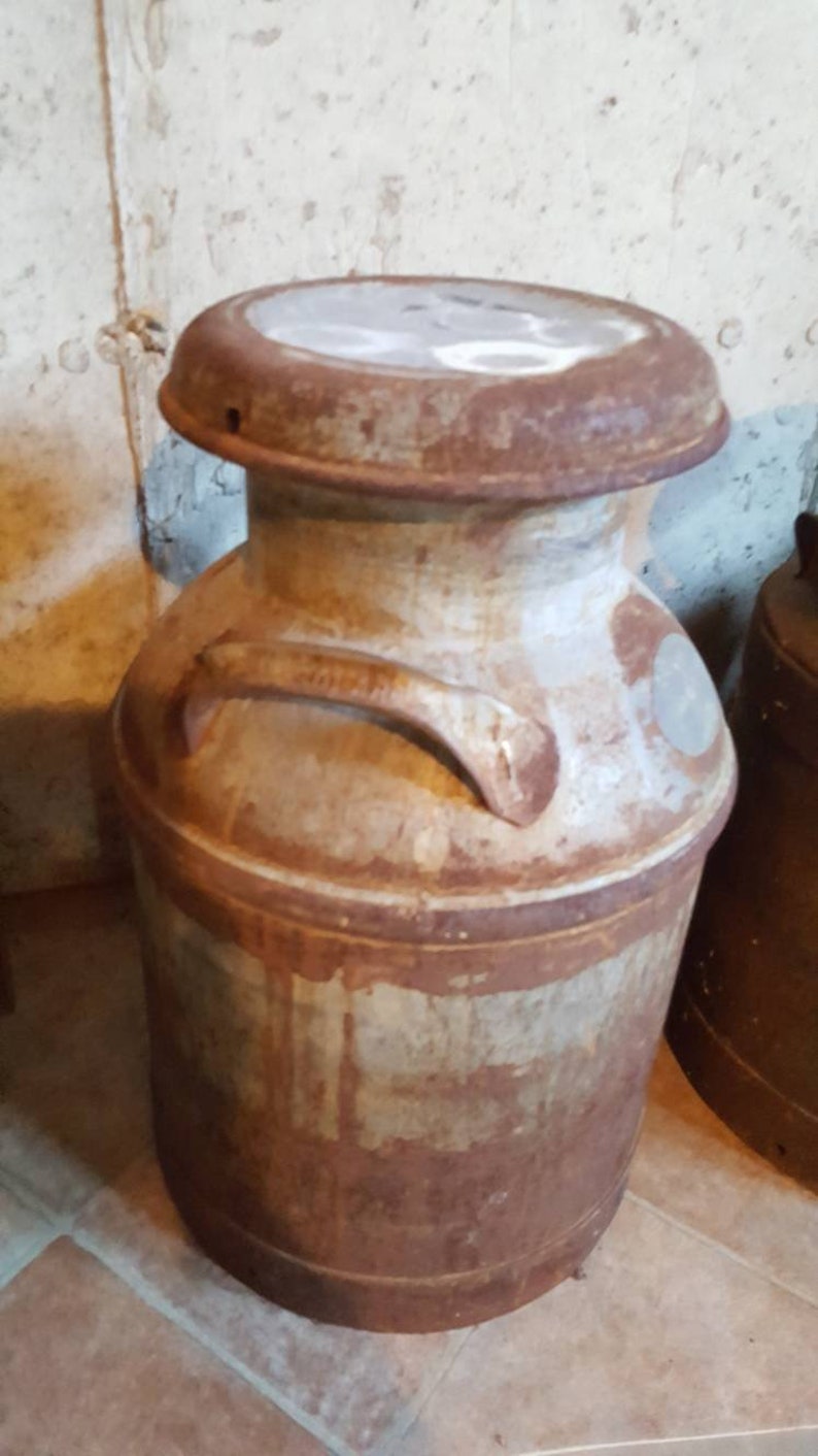Antique Dairy Farm Milk Cans this one is not available but we Etsy