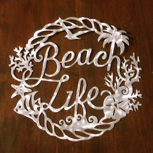 14” Coastal Nautical Beach Life Wall Art for inside or outside with various sea life. Won’t ever rust