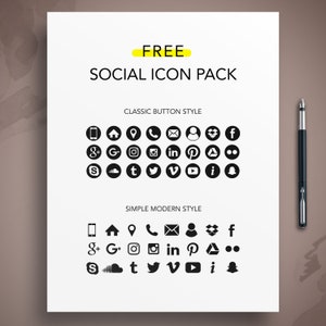 May include: A white sheet with the text "FREE SOCIAL ICON PACK" and two rows of black social media icons in classic button and simple modern styles. A black pen rests on the right side of the sheet.