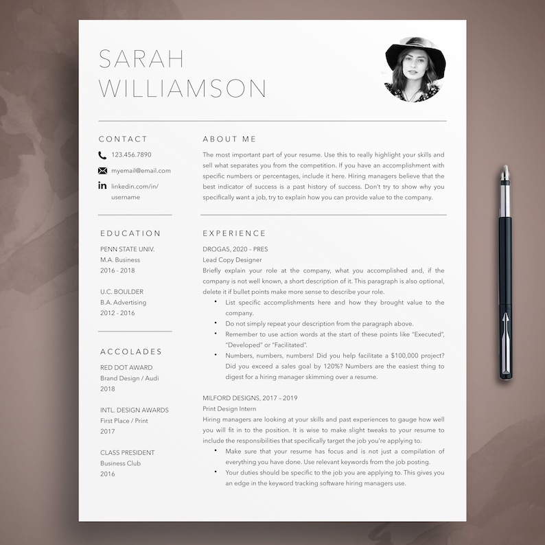 May include: A professional resume template with a photo, contact information, education, experience, and accolades. A black pen rests on the right side of the page. The resume is designed for job applications.