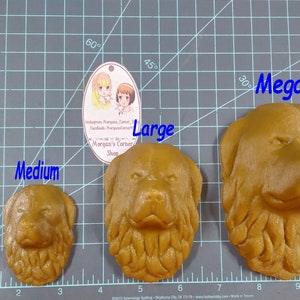 May include: Four different sizes of brown dog head sculptures, labeled "Small", "Medium", "Large", and "Mega". The sculptures are made of a textured material and are displayed on a gray grid.