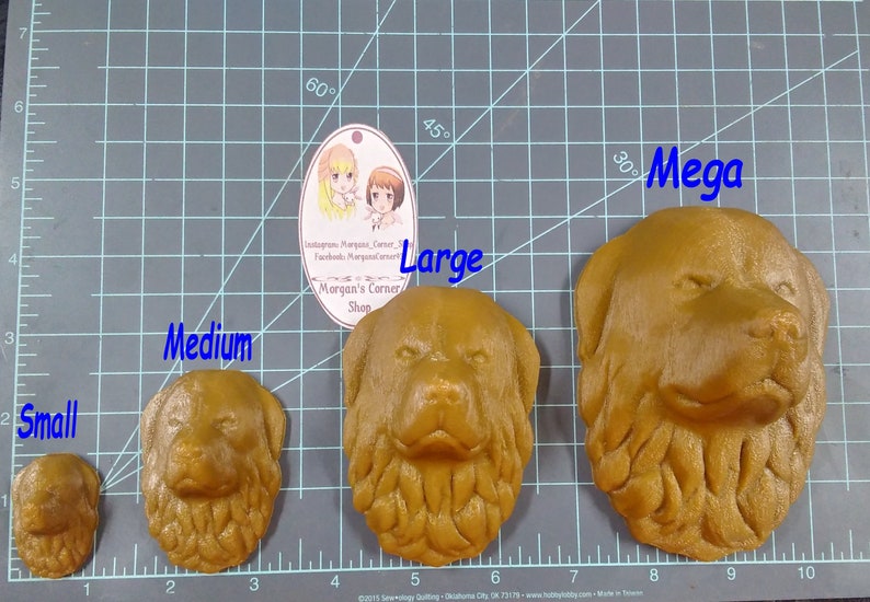 May include: Four different sizes of brown dog head sculptures, labeled "Small", "Medium", "Large", and "Mega". The sculptures are made of a textured material and are displayed on a gray grid.