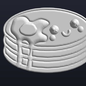 May include: A white ceramic pancake stack with a white glaze and a white egg yolk on top. The egg yolk is dripping down the sides of the stack.