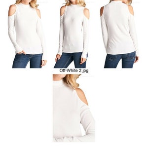May include: A white long-sleeved shirt with a mock neck and cold shoulder detail. The shirt is made of a soft, stretchy fabric.