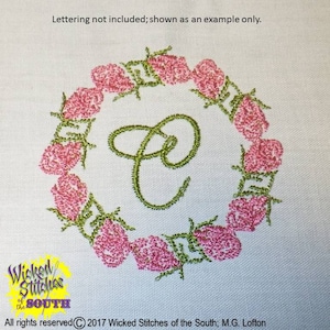 May include: Embroidered design of a wreath of pink roses with green leaves and a cursive letter C in the center. The design is on a white fabric background.