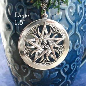 May include: A silver pendant featuring a pentacle with a triple moon design. The pendant is 1.5 inches in diameter and has a Celtic knot border.
