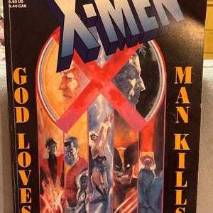 May include: A comic book cover for X-Men, featuring the title in a 3D blue and white font over a red X. The cover art includes illustrations of various characters and the text "GOD LOVES" and "MAN KILLS".