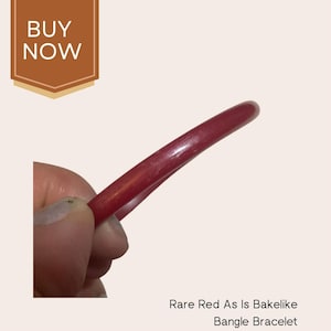 Thin red Bakelite bracelet warped slightly discounted red shimmer color
