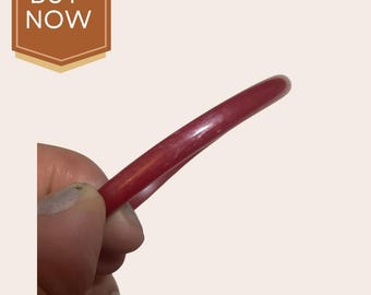 Thin red Bakelite bracelet warped slightly discounted red shimmer color