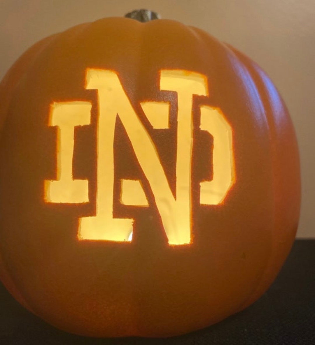 One 9 Notre Dame With Just ND Carved Out On A Foam Pumpkin Pick Orange one-9-notre-dame-with-just-nd-carved-out-on-a-foam-pumpkin-pick-orange