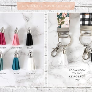 May include: Keyfobs with various tassel colors: fuchsia, light pink, black, turquoise, blue, and white. Floral and black and white plaid keychains with silver hardware and white and black tassels. Text reads "Customize Your Keyfob".