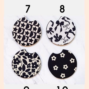 May include: Four black and white car coasters with different patterns are displayed. The patterns include stars and moons, bows, floral designs, and small flowers. The text "CHOOSE YOUR PATTERN" is at the top.