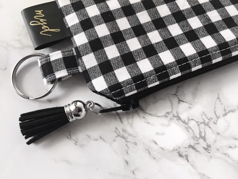 white keychain wallet