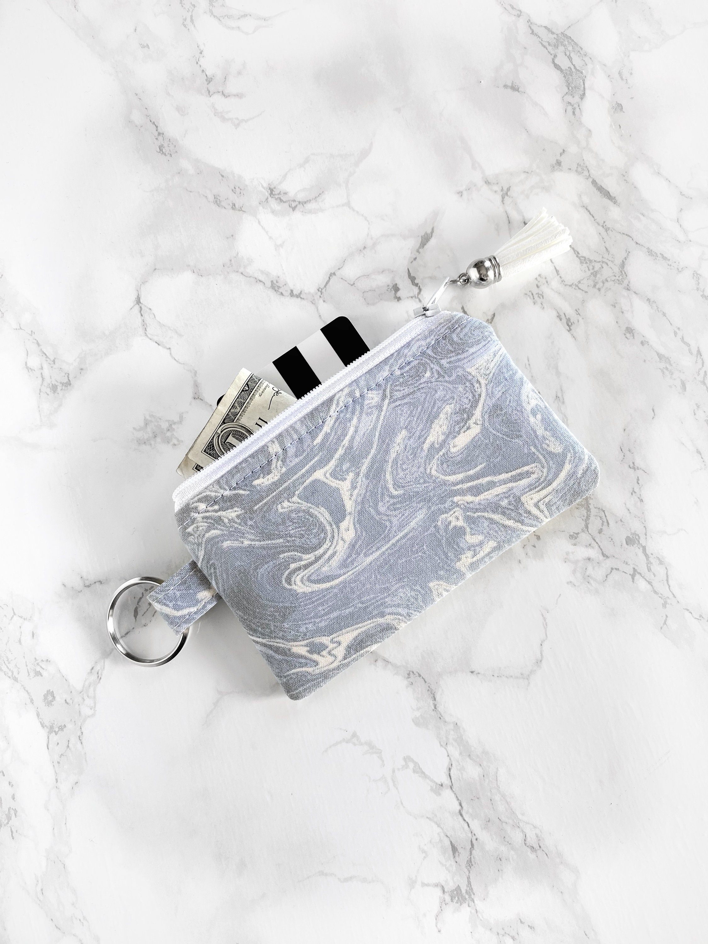 white keychain wallet