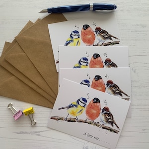 May include: Four cards featuring a watercolour illustration of three birds singing on a branch. The birds are a blue tit, a robin, and a sparrow. The text on the card reads "A little note..."