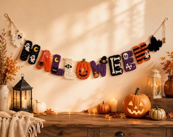 May include: A decorative Halloween banner featuring plush, textured letters strung on a cord. Each letter displays unique seasonal motifs including ghosts, a spider, a black cat, a mummy, a pumpkin, a witch hat, a broom, bones, and a skull.