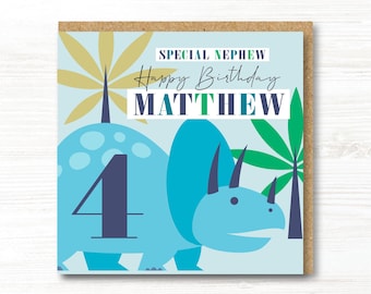 May include: A square greeting card featuring a light blue triceratops dinosaur with a large dark blue number 4 on its side. The text reads SPECIAL NEPHEW Happy Birthday MATTHEW. The background includes stylized green and gold palm leaves.