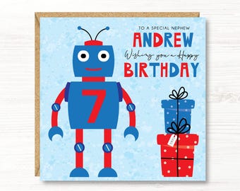 May include: A birthday card featuring a blue robot with red accents and the number 7. The card reads "TO A SPECIAL NEPHEW ANDREW Wishing you a Happy BIRTHDAY" with two gift boxes.