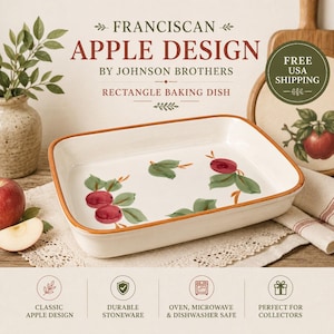 May include: A rectangular white ceramic baking dish featuring a hand-painted apple design with red fruit and green leaves. The dish has a brown rim and is labeled as Franciscan Apple Design by Johnson Brothers. The interior surface is smooth.
