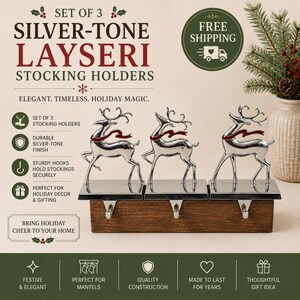 May include: A set of three silver-tone metal stocking holders, each featuring a reindeer figure with a red scarf. The reindeer are mounted on a rectangular wooden base with three metal hooks extending downward for hanging stockings.