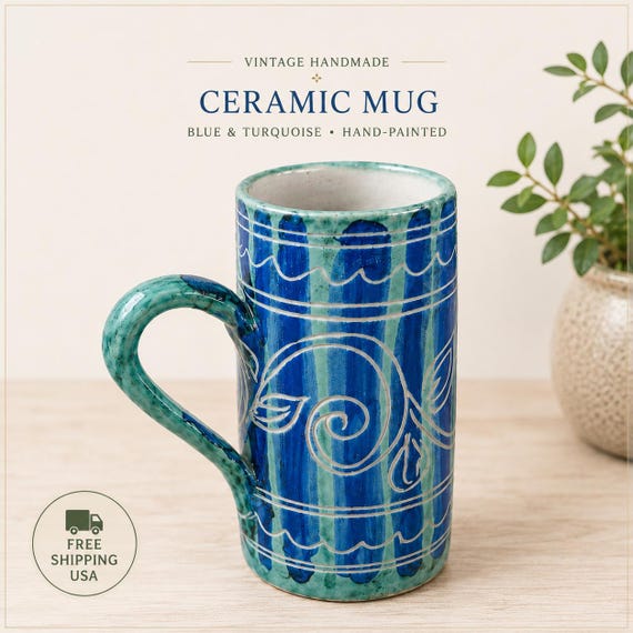 A *signed* studio art pottery mug with hand-painted blue-turquoise glaze — the 'signed' and 'one of a kind' details signal a real studio potter with an identifiable aesthetic, not a factory.